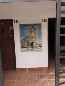 a wall with a picture of a building on it at Apartamento Robledo de Chavela Plaza 1A in Robledo de Chavela