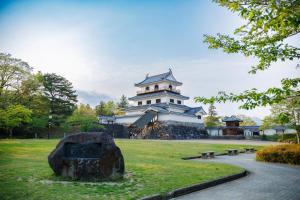 a building in a park with a statue in front of it at -IRAKA- - Vacation STAY 19152 in Shiroishi