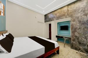 Ένα ή περισσότερα κρεβάτια σε δωμάτιο στο Hotel O Panda Celebration