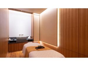 a hotel room with a bed and a mirror at Skye Niseko - Vacation STAY 70618v in Niseko +48 photos