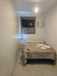 Katil atau katil-katil dalam bilik di APARTAMENTO PROXIMO AO AEROPORTo 2km do Centro de Convenções