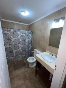 a bathroom with a sink and a toilet at Apartamento in Monte Grande - AirPort Ezeiza - 15min EZE in Monte Grande