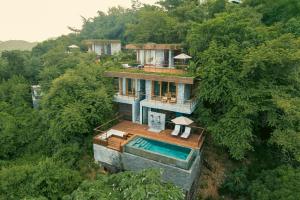 an aerial view of a house in the forest at Ocama in Las Galeras