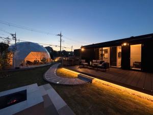a backyard with a igloo and a house at MGBACE - Vacation STAY 19466 in Kubo