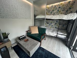 a room with a chair and a bunk bed at MGBACE - Vacation STAY 19466 in Kubo