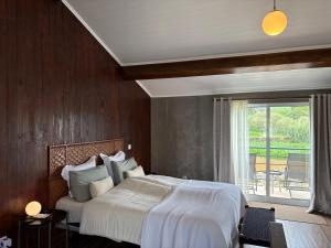 Postel nebo postele na pokoji v ubytování Villa Várzea Hiker Nest