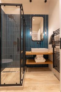 a bathroom with a shower and a sink at Nest in the City Studio Volos in Volos