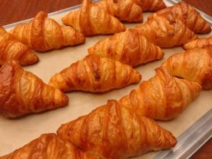 a tray of croissants sitting on a table at Smile Hotel Namba - Vacation STAY 37197v in Osaka