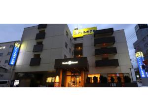a building with a sign on the side of it at Smile Hotel Aomori - Vacation STAY 74797v in Aomori