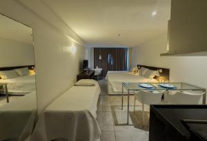 Ένα ή περισσότερα κρεβάτια σε δωμάτιο στο Ritz Suítes 215 Beira-Mar - Hosti