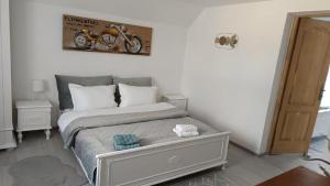 a bedroom with a bed with a motorcycle on the wall at casa Flav in Iaşi