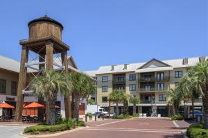 a hotel with a water tower in front of a building at Redfish Village M1-220 in Blue Mountain Beach