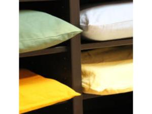 a bunk bed with pillows on a shelf at Smile Hotel Tokyo Shinkoiwa - Vacation STAY 82164v in Tokyo