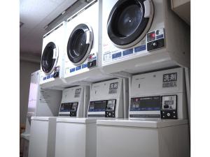 a row of washing machines on display in a store at Smile Hotel Tokyo Shinkoiwa - Vacation STAY 82180v in Tokyo