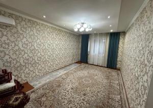 a room with an empty room with a wall at Частный дом в Бишкеке in Bishkek