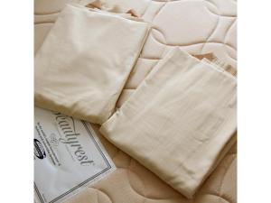 a bed with two white bags on top of it at Smile Hotel Tokyo Shinkoiwa - Vacation STAY 33631v in Tokyo