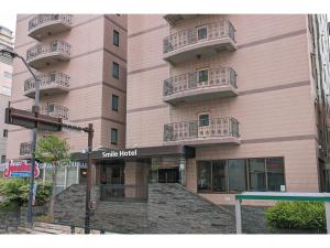 a building with balconies on the side of it at Smile Hotel Tokyo Shinkoiwa - Vacation STAY 33628v in Tokyo