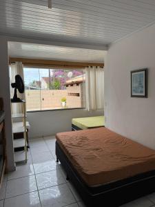 Katil atau katil-katil dalam bilik di Casa com piscina em Guaratuba +21 gambar