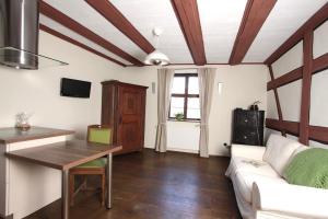 a living room with a couch and a table at Winter'sches Haus in Nördlingen