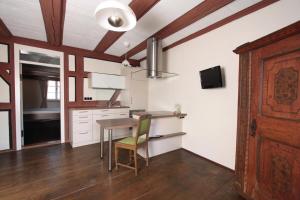 a kitchen with a table and a dining room at Winter'sches Haus in Nördlingen