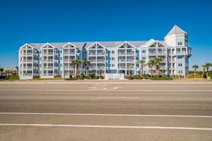 a large apartment building with a street in front of it at Grand Caribbean 121 in Orange Beach
