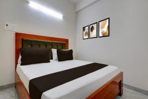 Postel nebo postele na pokoji v ubytování Hotel O The Urban