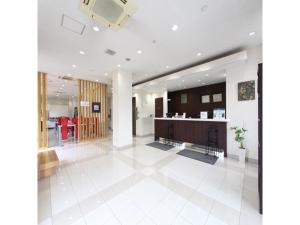 a large living room with a white tile floor at Smile Hotel Sakurambo Higashine - Vacation STAY 29997v in Higashine