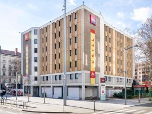 a large building on a city street with a street at ibis Lyon Gare Part Dieu in Lyon