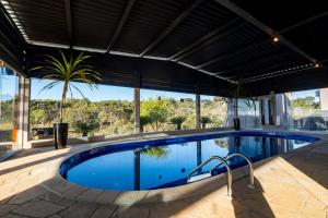 Πισίνα στο ή κοντά στο Chácara Cabanas e Eventos Peniel
