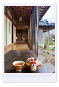 a bowl of tea and a bowl of soup on a table at Hot Spring Guest House Mikunien - Vacation STAY 18629v in Sakai