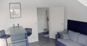 Posezení v ubytování CityStay Wolfsburg - Beetle + 23 fotografií