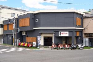 a group of motorcycles parked in front of a building at Onomichi Stay Gen - Vacation STAY 24149v in Onomichi