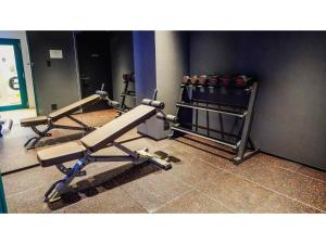 a gym with two dumbbells and two at THE GALA HOTEL UMEDA - Vacation STAY 24228v in Osaka