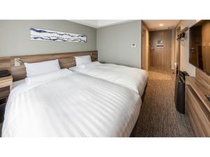 a large white bed in a hotel room at Far East Village Hotel Tokyo Ariake - Vacation STAY 31643v in Tokyo +41 photos