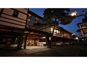 a building with a street light in front of it at Osakaya Ryokan - Vacation STAY 30201v in Kusatsu