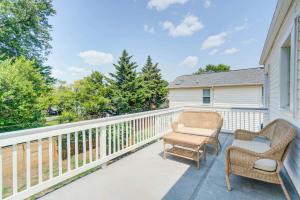 a balcony with two chairs and a table at FREE Parking Walk to METRO Arlington 2 BR House in Virginia Highlands