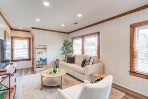 a living room with a couch and a table at FREE Parking Walk to METRO Arlington 2 BR House in Virginia Highlands