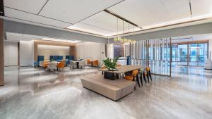 a meeting room with a table and chairs in a building at Holiday Inn Express Xi'an Caotang Technology Park by IHG in Fengyukou