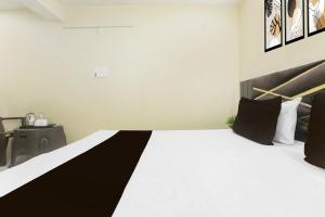 Ένα ή περισσότερα κρεβάτια σε δωμάτιο στο Hotel O Galaxy Inn +21 φωτογραφίες