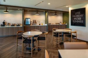 a restaurant with two tables and a counter at Fairfield Inn & Suites by Marriott Foley in Foley
