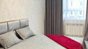 Postel nebo postele na pokoji v ubytování ЖК Prime Park, сердце отдыха рядом с памятником Байдибек би, Зоопарком, Дендропарком, Shymkent Mall и парк музыкальным фонтаном Shymkent City