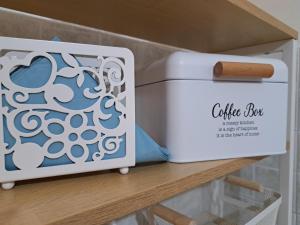 a white box sitting on top of a shelf at B&B Vola Vola Vola in Ortona