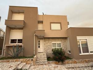 a house with a stone path in front of it at Villa Nadia in Bar