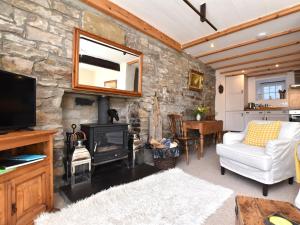 a living room with a stone wall at 1 Bed in Richmond 36769 in Reeth