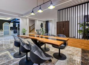 a dining room with a wooden table and chairs at Host Prime Villas in Cairo +44 photos