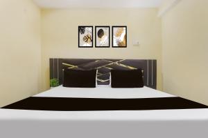 Ένα ή περισσότερα κρεβάτια σε δωμάτιο στο Hotel O Galaxy Inn