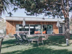 a house with a table and chairs in the yard at ibis Aix en Provence in Aix-en-Provence