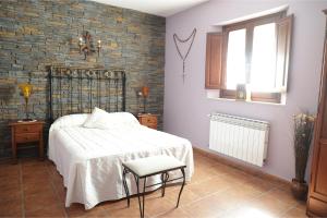 Katil atau katil-katil dalam bilik di Casa Rural La Almazara Del Cristo