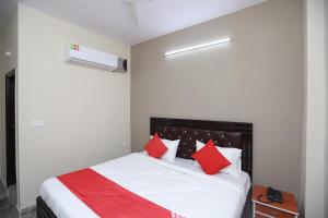 Ένα ή περισσότερα κρεβάτια σε δωμάτιο στο Hotel O Silverline Residency
