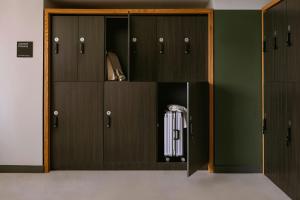 a locker room with wooden doors and auggage at Nester Finn St Lawrence Market in Toronto